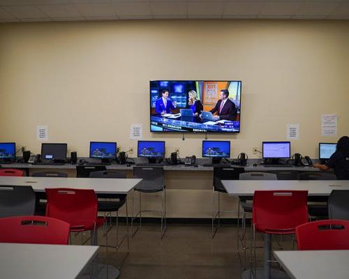 Quik Trip Training Room with workstations and video display