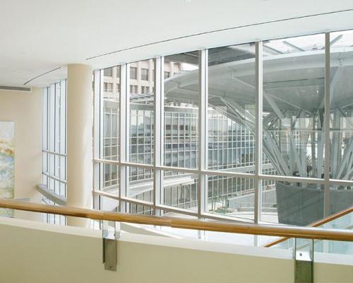 Interior photo of Baptist Heart Hospital, looking out window and over balcony.